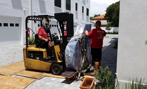 Two Men Carefully Moving a Piano | 3GuysMoving.com